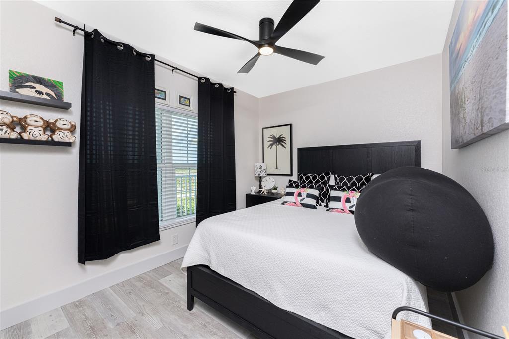 8405 Placida Road, Unit 406 Placida, FL 33946 - Photo 32 of 55 a bedroom with a bed and a dresser