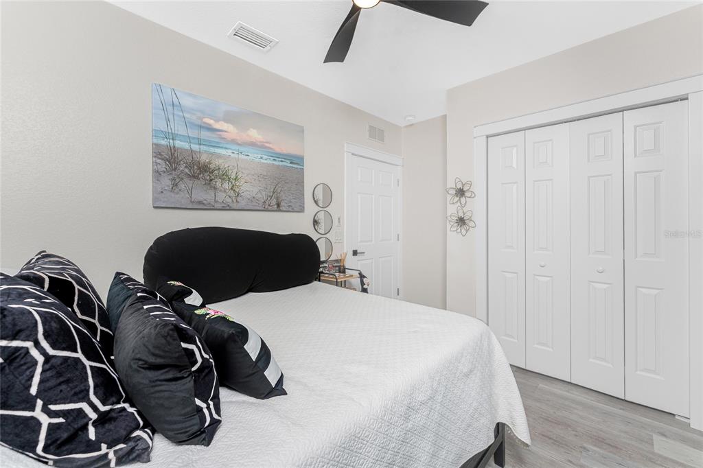 8405 Placida Road, Unit 406 Placida, FL 33946 - Photo 33 of 55 a bed room with a bed and a painting on the wall