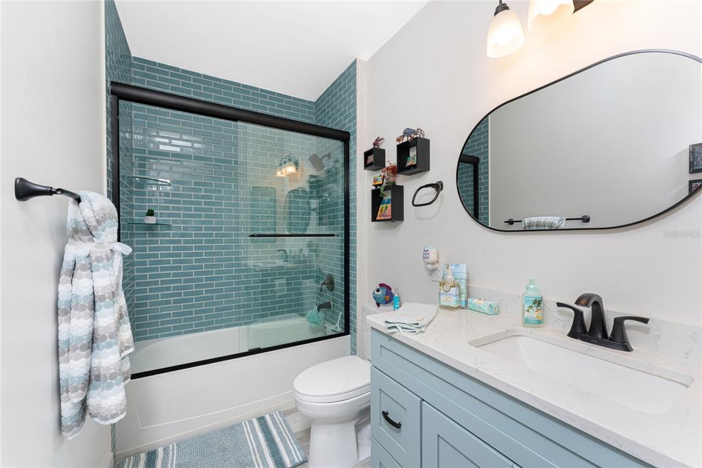 8405 Placida Road, Unit 406 Placida, FL 33946 - Photo 34 of 55 a bathroom with a sink a toilet and shower