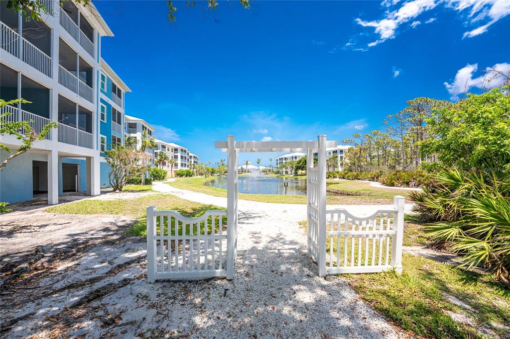 8405 Placida Road, Unit 406 Placida, FL 33946 - Photo 39 of 55 a view of a house with a yard
