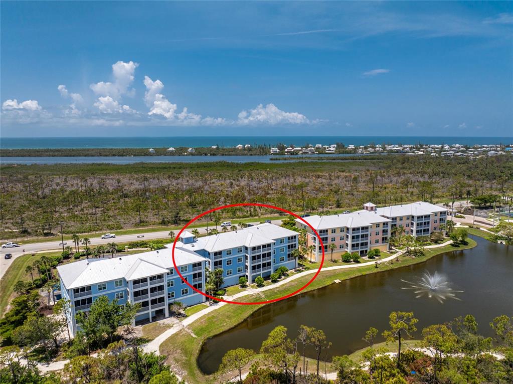 8405 Placida Road, Unit 406 Placida, FL 33946 - Photo 42 of 55 a view of a lake with a city