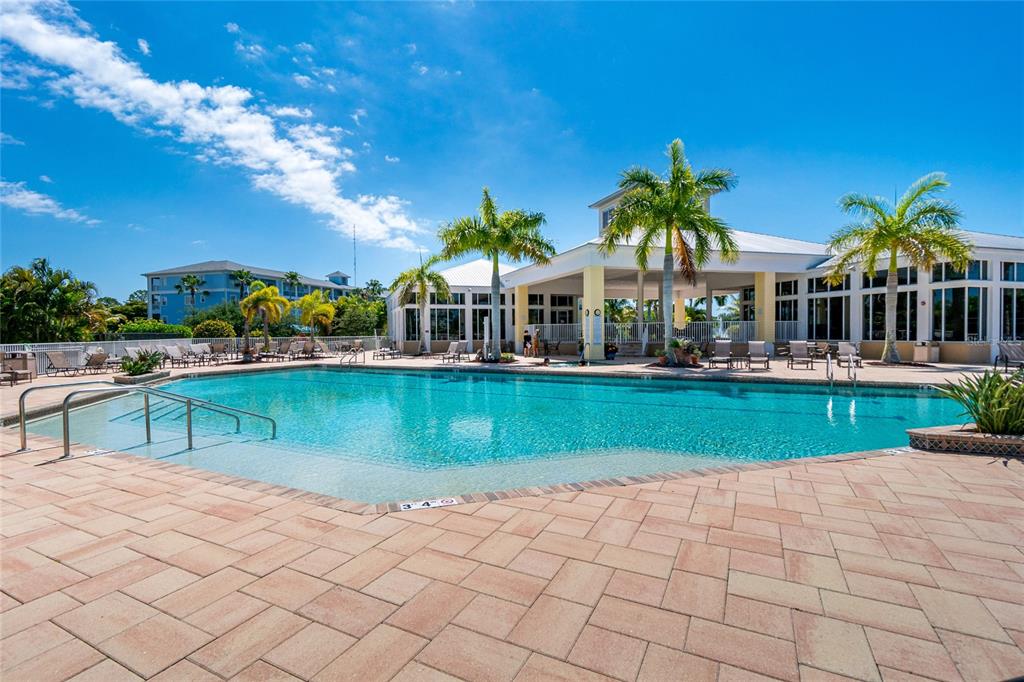 8405 Placida Road, Unit 406 Placida, FL 33946 - Photo 51 of 55 a view of house with swimming pool and outdoor seating