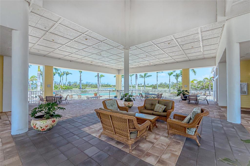 8405 Placida Road, Unit 406 Placida, FL 33946 - Photo 54 of 55 a living room with furniture and a potted plant