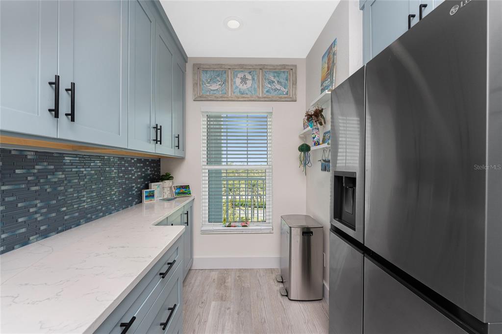 8405 Placida Road, Unit 406 Placida, FL 33946 - Photo 10 of 55 a view of kitchen and utility room