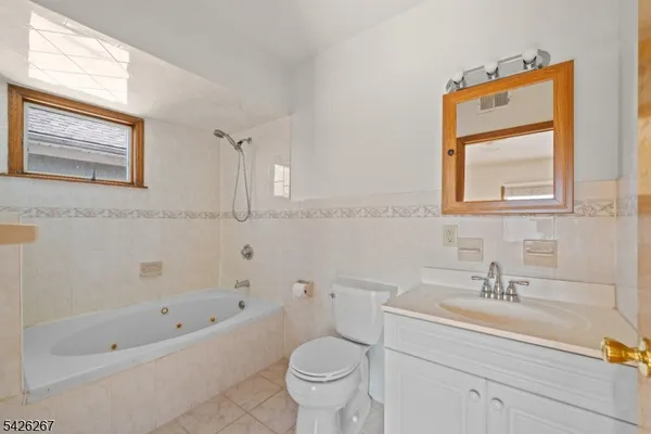 a bathroom with a sink a toilet and a bathtub