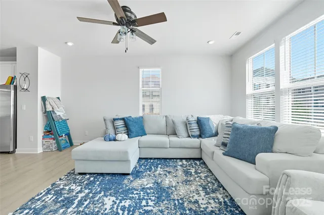 a bedroom with furniture toys and a window