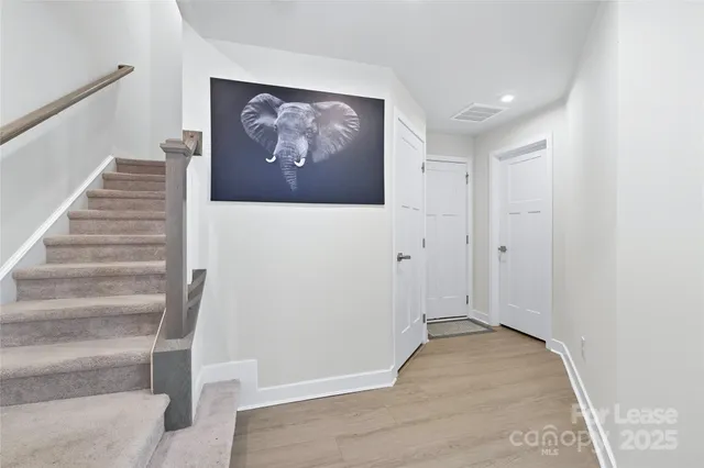a view of a livingroom with workspace and a window