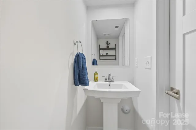 a large kitchen with a table and chairs