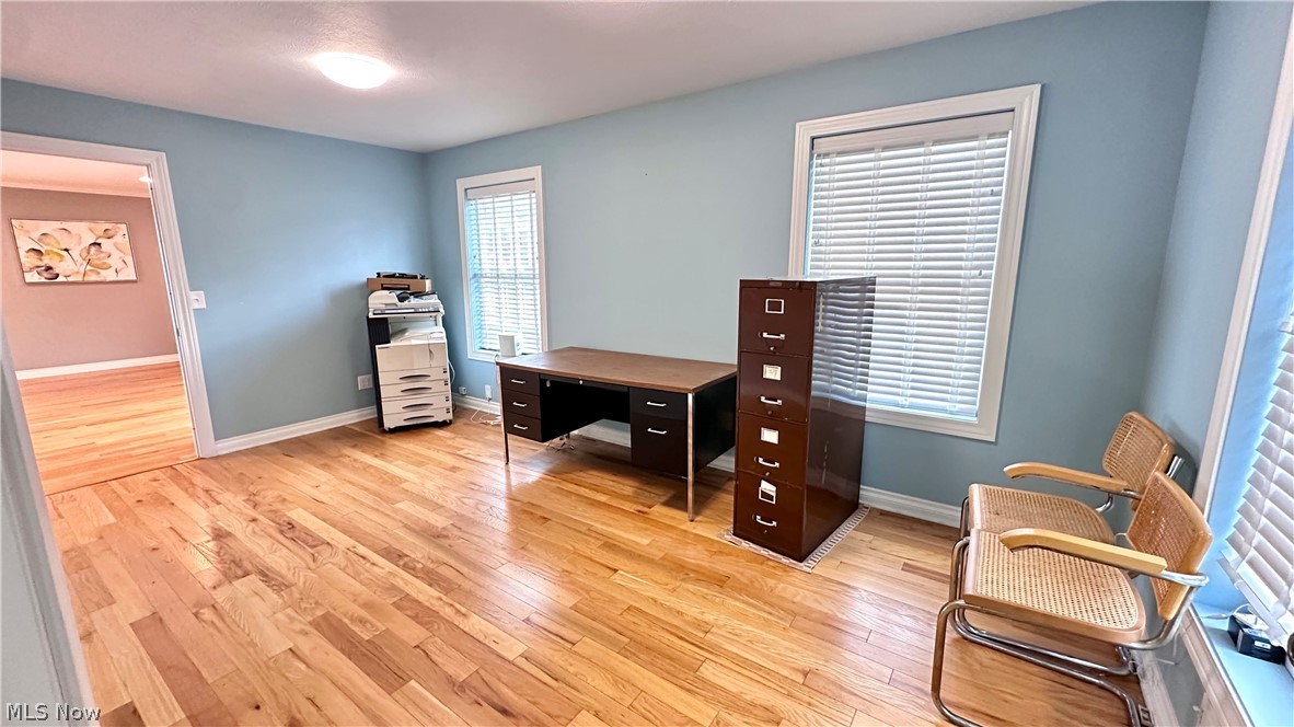 2603 Rockefeller Road Wickliffe, OH 44092 - Photo 11 of 34 Hardwood flooring extends throughout this room, featuring light blue walls and white trim