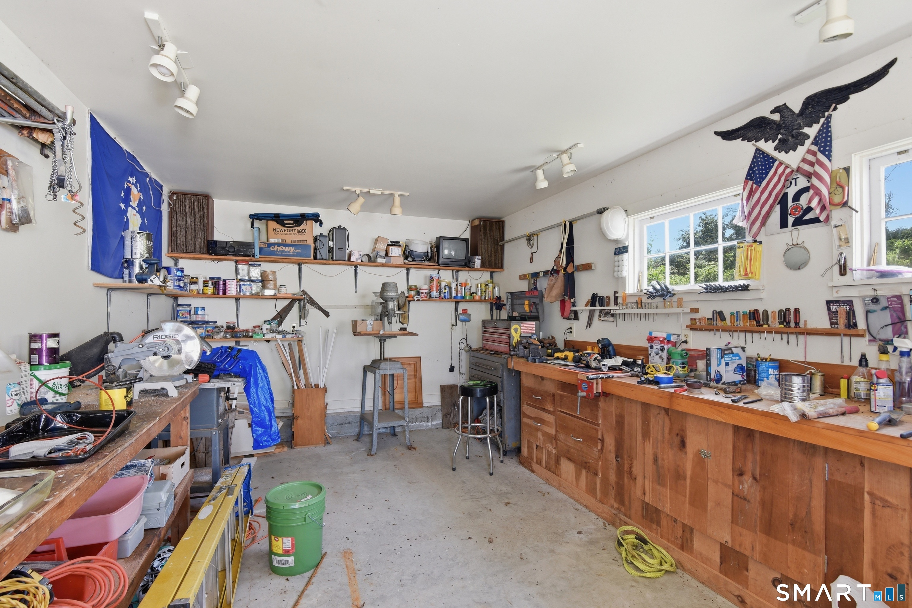 511 Perrin Road Woodstock, CT 06281 - Photo 37 of 40 The workshop is attached to the garage and is complete with workbenches and cabinetry.