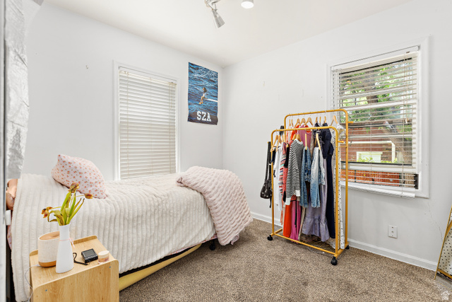 372 800 East Provo, UT 84606 - Photo 13 of 29 Bright room with light-colored walls and soft carpet flooring