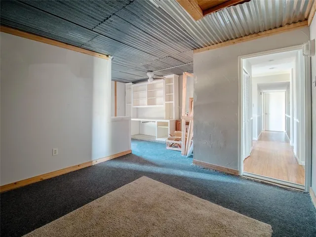 a view of room with window and cabinet