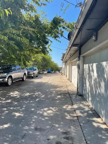 a view of a car parked on the side of a street