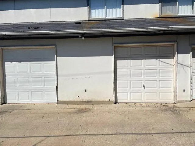 a view of wooden door and a window