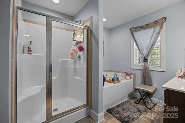 a bedroom with a bed couch and window