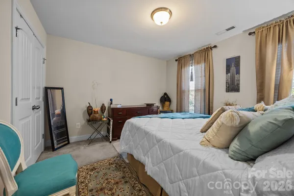 a bed room with a bed and a couch