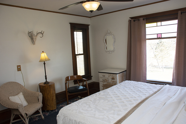 16477 Capp Road Morrison, IL 61270 - Photo 30 of 39 a bedroom with a bed and a chandelier
