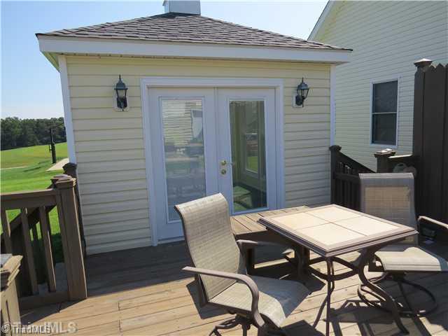 1010 Westmoreland Farm Road King, NC 27021 - Photo 14 of 16 Patio/Deck. One of the multiple sitting areas on the rear deck that leads in to the temperature controlled sunroom. What a great place to relax at the end of the day.... no matter what the temperature outside is.