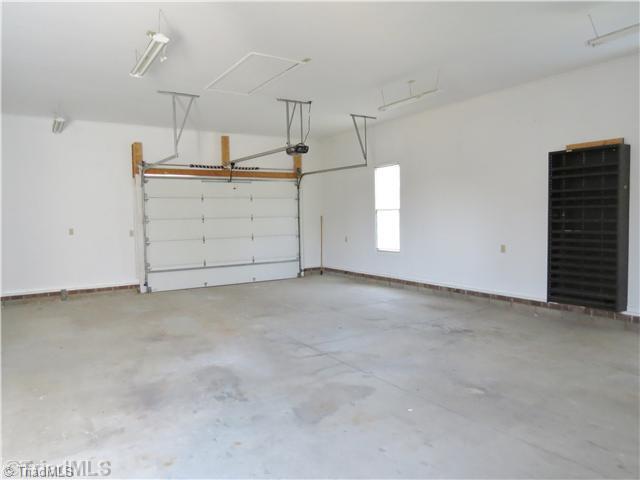 1010 Westmoreland Farm Road King, NC 27021 - Photo 15 of 16 Parking Lot/Garage. Garage #2 is a huge 24 ft. by 34 ft structure that is attached to the house with rear access to the deck. It has s 11.5 ft. ceiling that allows a lot of options when needing to garage boats and other sport vehicles.