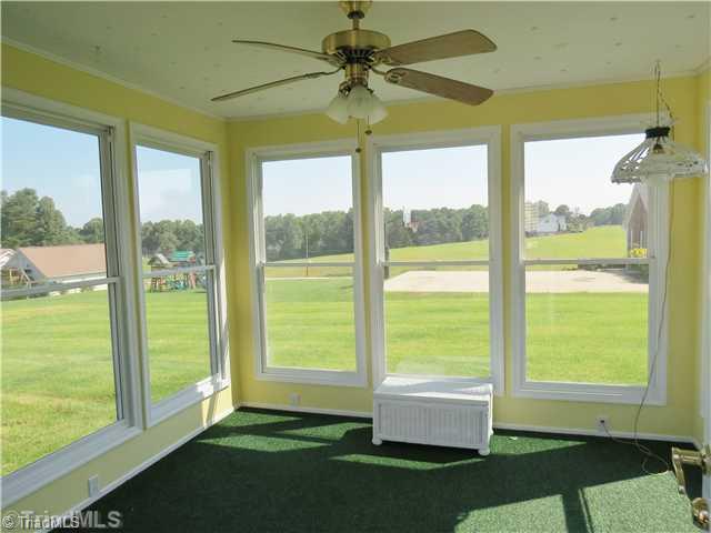 1010 Westmoreland Farm Road King, NC 27021 - Photo 4 of 16 Sunroom. The temperature controlled sunroom provides the perfect place to relax at the end of a long day.