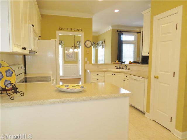 1010 Westmoreland Farm Road King, NC 27021 - Photo 6 of 16 Kitchen. The kitchen offers an eat-in bar, great cabinet space and corian covered counter tops. It s open to all of the living space with easy access to both the formal dining room and breakfast area.