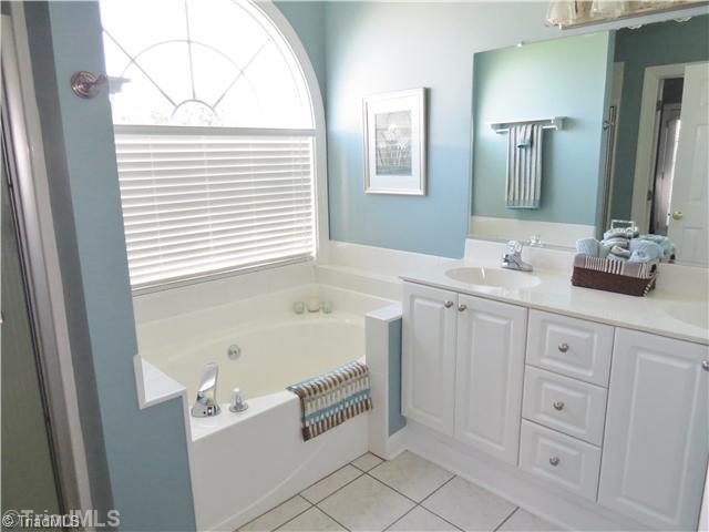1010 Westmoreland Farm Road King, NC 27021 - Photo 10 of 16 Master Bath/Spa. The master suite offers a huge bath with a dual vanity, a large garden tub and separate shower.