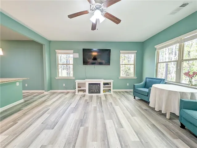 a living room with furniture and a window