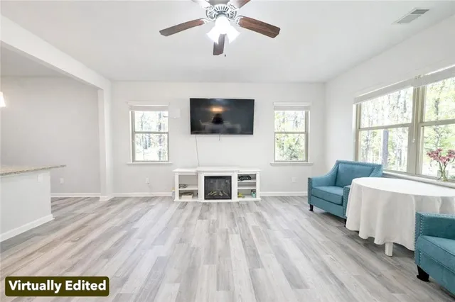 a living room with furniture and a large window