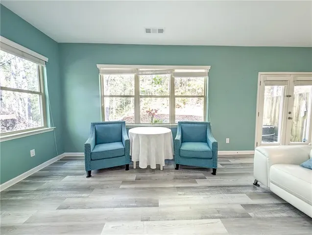 a living room with furniture fireplace and flat screen tv