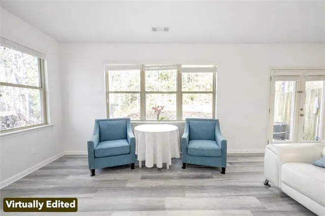 a living room with furniture fireplace and flat screen tv
