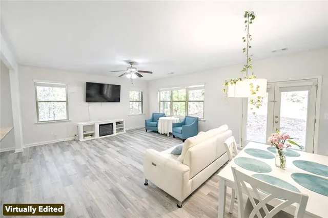 a kitchen with kitchen island granite countertop a sink stove and refrigerator