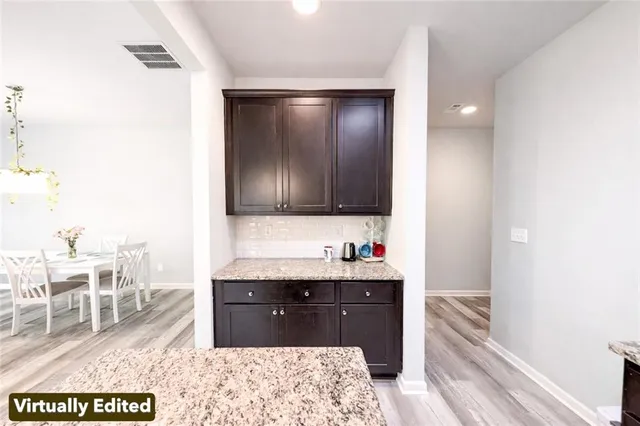 a bed room with a bed a television and dresser