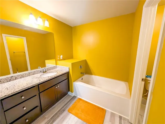 a bedroom with a bed and a table