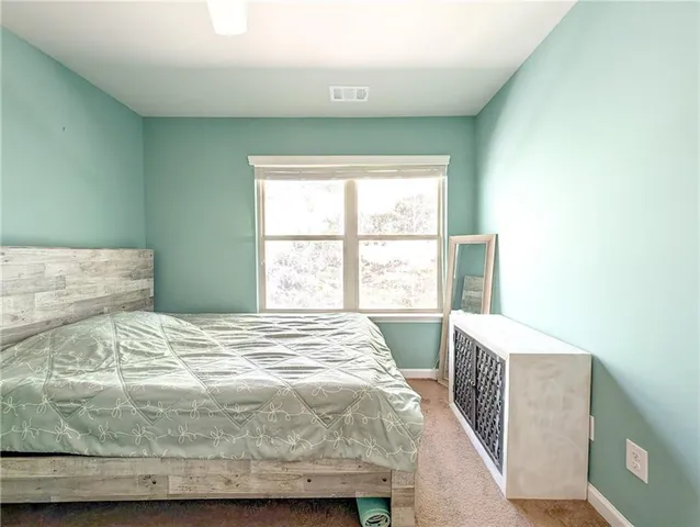 a view of a backyard with snow on the road