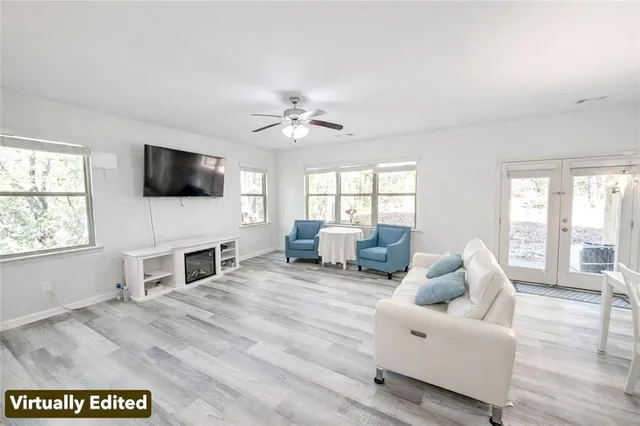 a view of living room with furniture and flat screen tv
