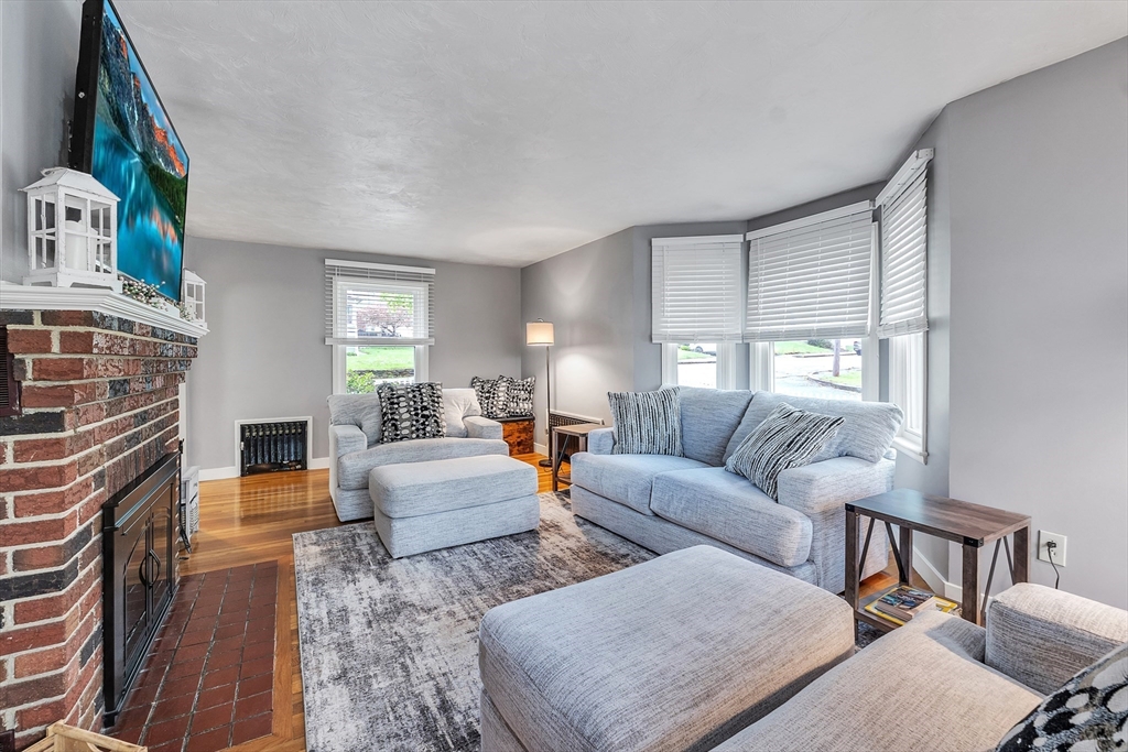 22 Lanark Street Worcester, MA 01603 - Photo 11 of 33 a living room with furniture and a fireplace