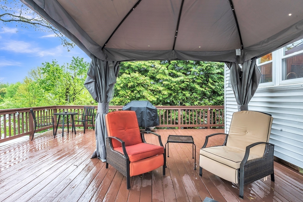 22 Lanark Street Worcester, MA 01603 - Photo 27 of 33 a balcony with wooden floor and outdoor seating