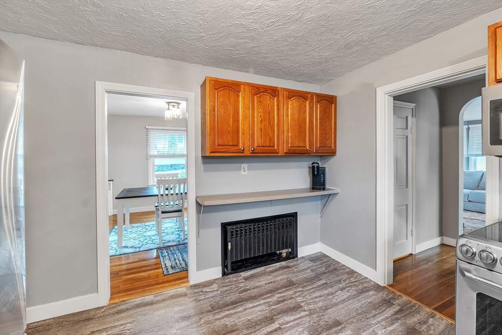 22 Lanark Street Worcester, MA 01603 - Photo 6 of 33 a view of an empty room with wooden floor and a window