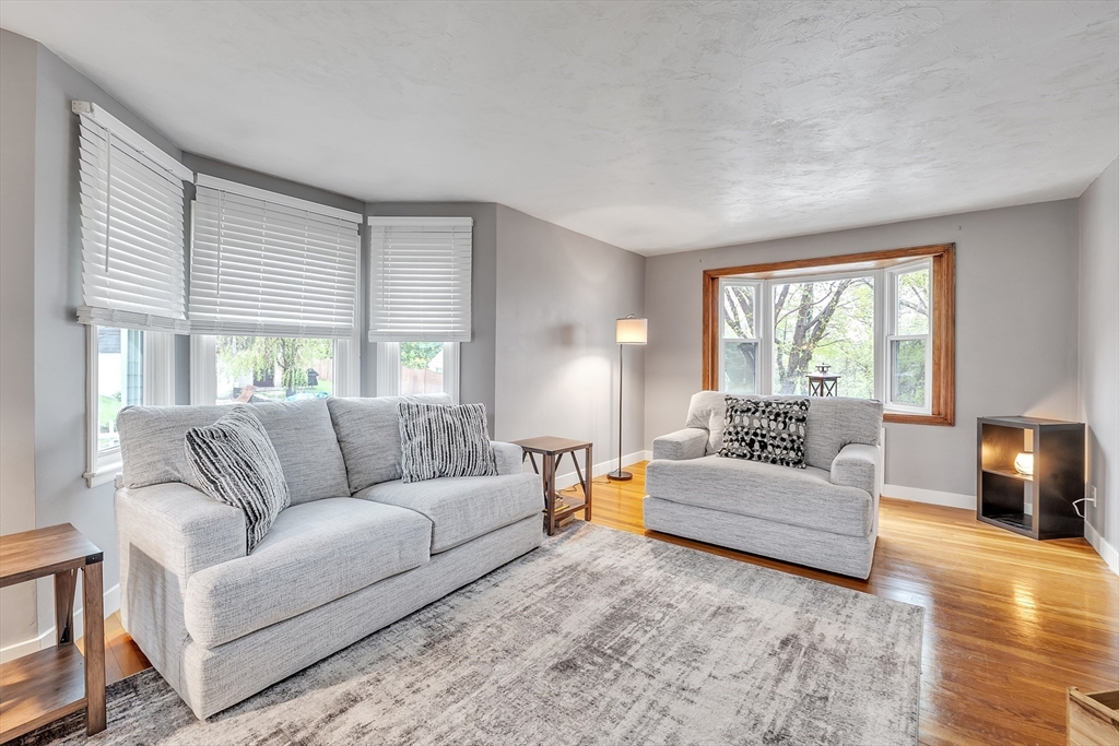 22 Lanark Street Worcester, MA 01603 - Photo 9 of 33 a living room with furniture and a large window