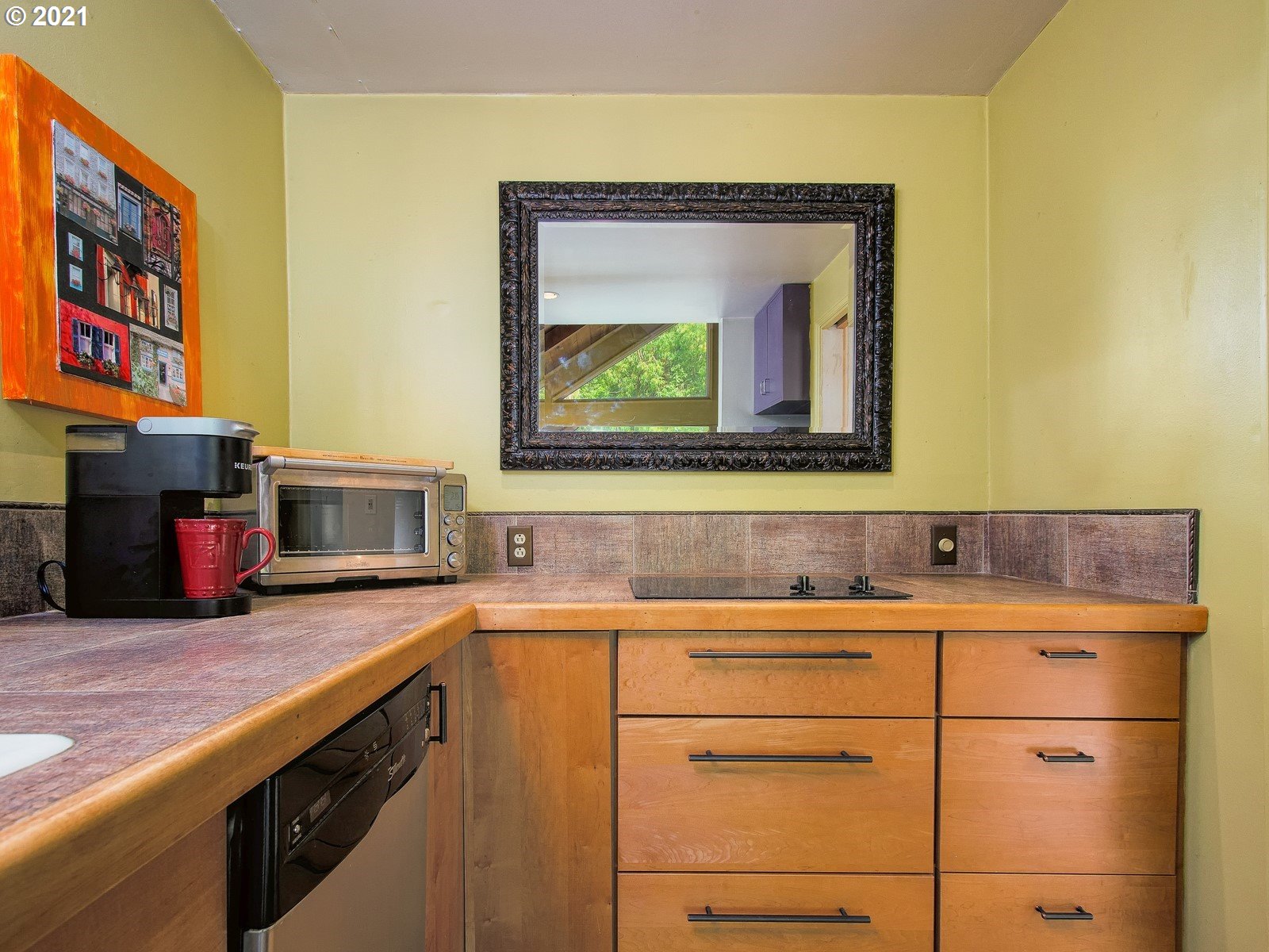 7720 South Macadam Avenue, Unit 8 Portland, OR 97219 - Photo 12 of 32 a kitchen with a sink and cabinets