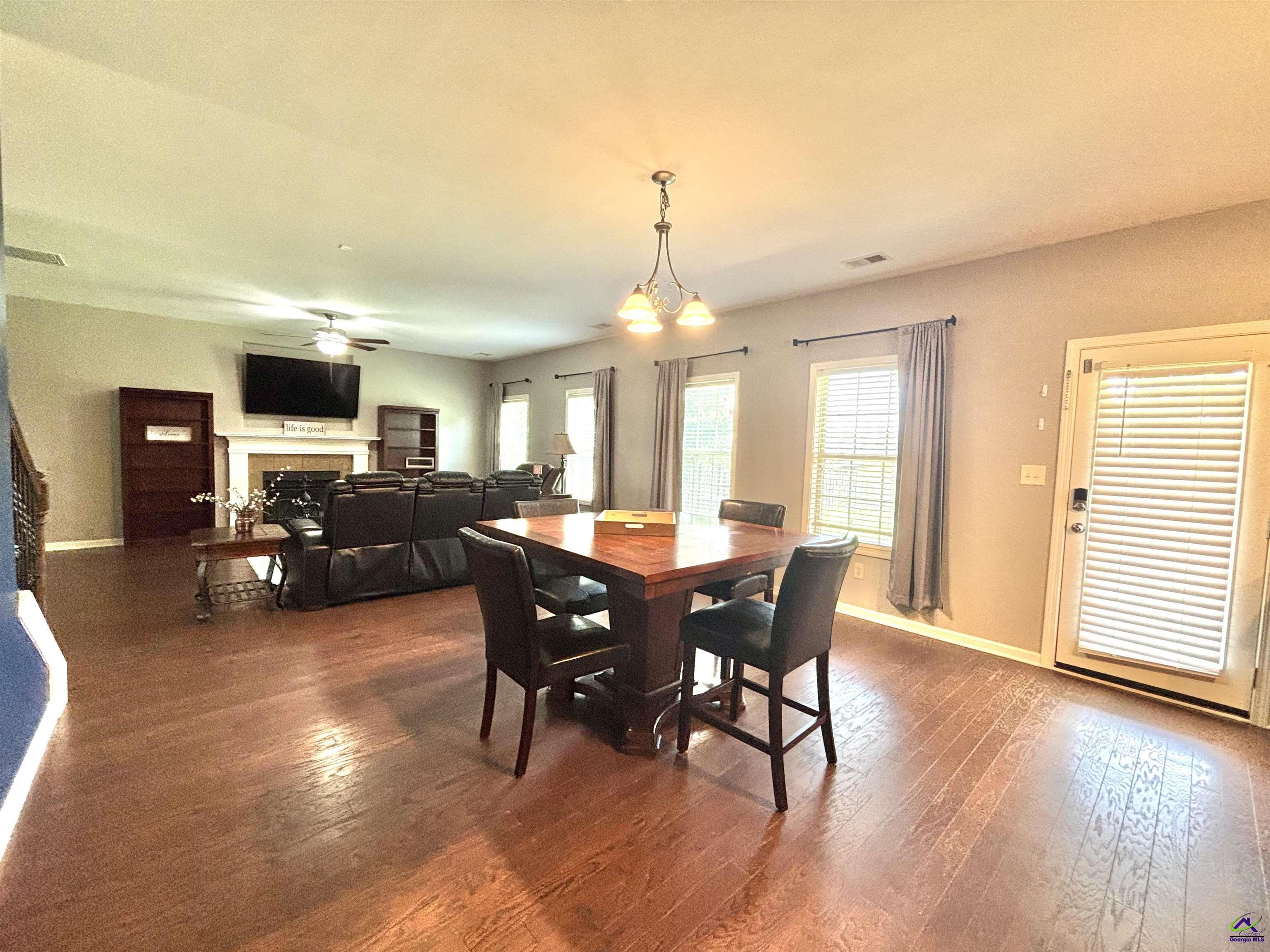 600 Post Oak Way Warner Robins, GA 31088 - Photo 17 of 50 a view of a dining room with furniture and wooden floor