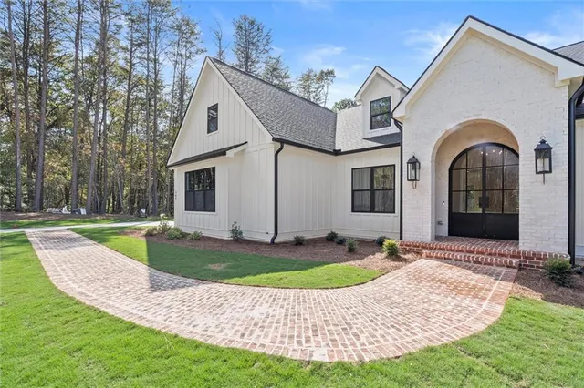 an empty room with a window and a ceiling fan