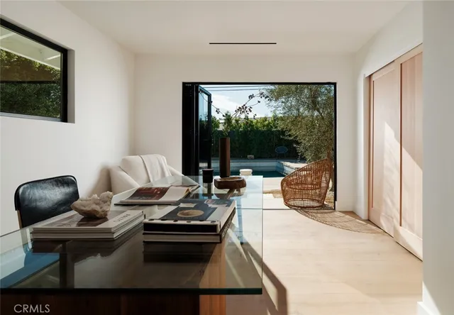 a room with painting and a table