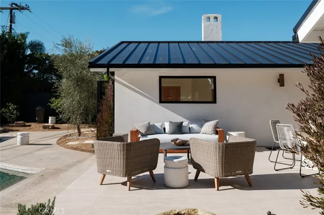 a wooden bench sitting in front of a building