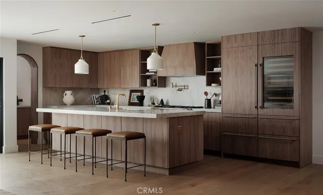 a kitchen with granite countertop a sink a counter space appliances and cabinets