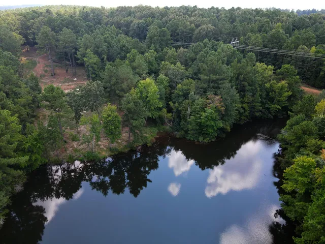 an aerial view of mountain with yard