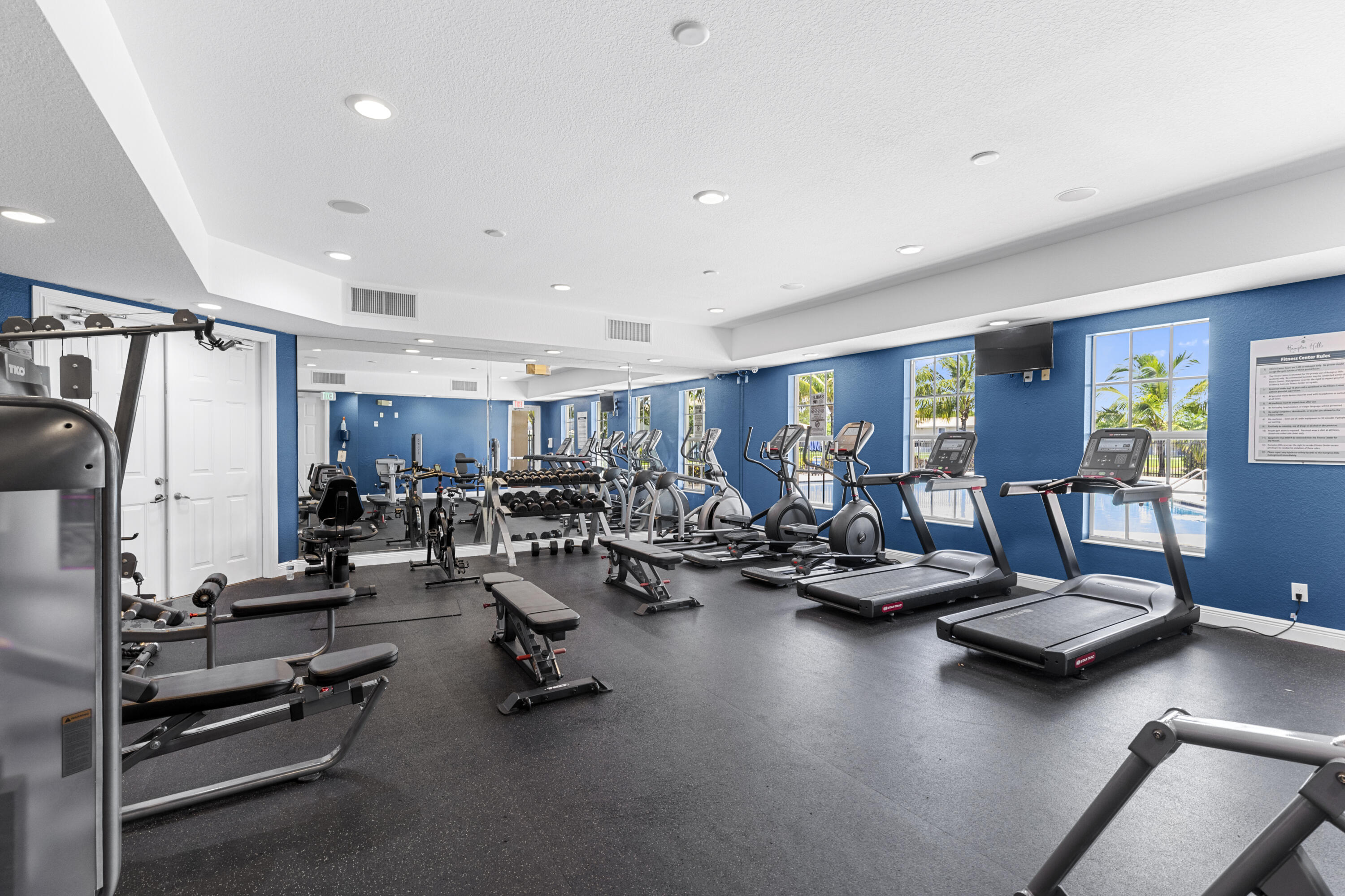 9107 Chambers Street, Unit 9107 Tamarac, FL 33321 - Photo 27 of 30 a view of a room with gym equipment