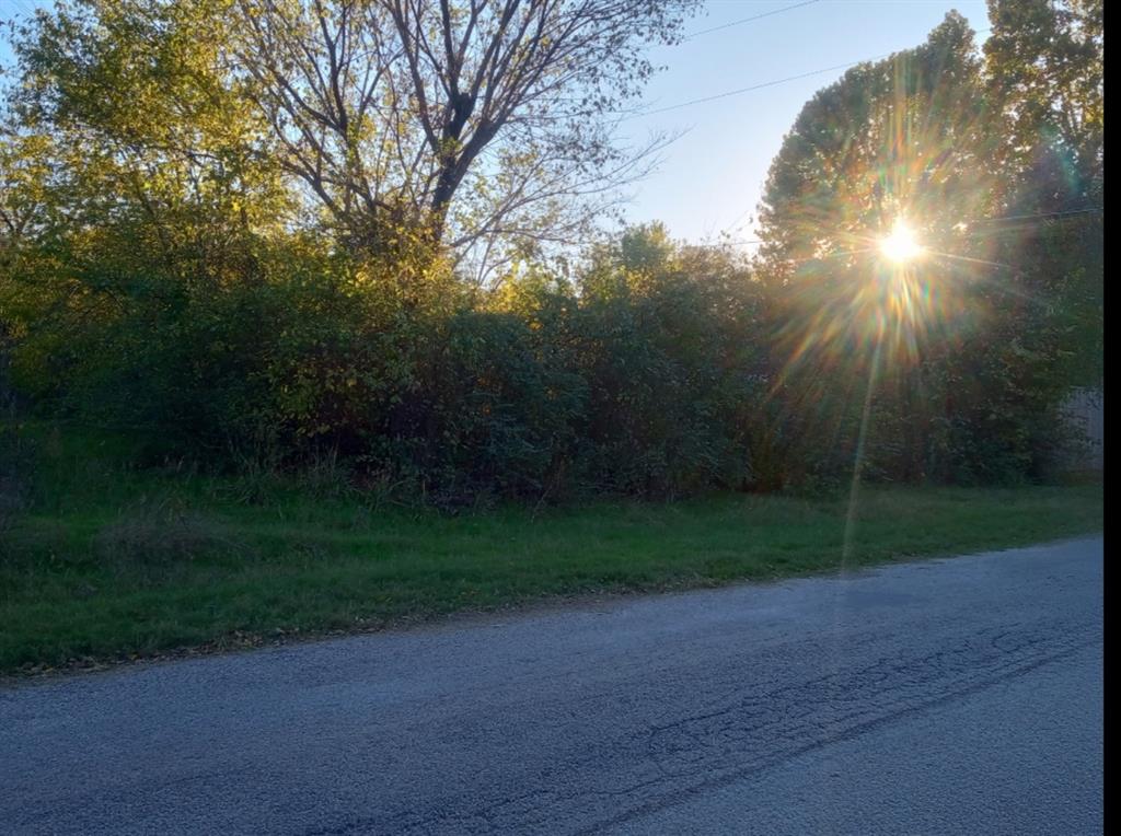 7071 Darling Street Azle, TX 76020 - Photo 1 of 6 a view of a yard and basketball court