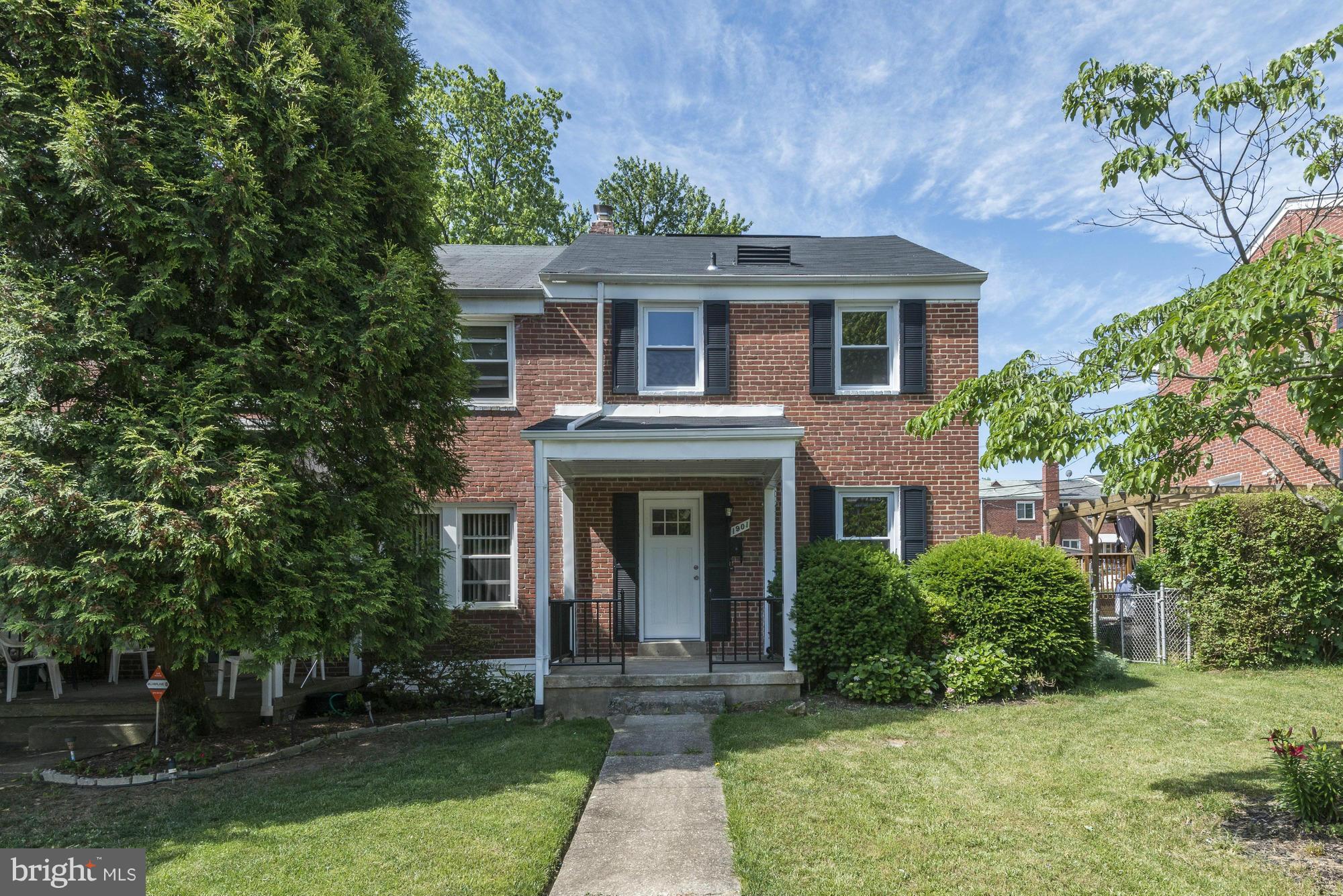 1901 Swansea Road Baltimore, MD 21239 - Photo 1 of 28 a front view of a house with garden