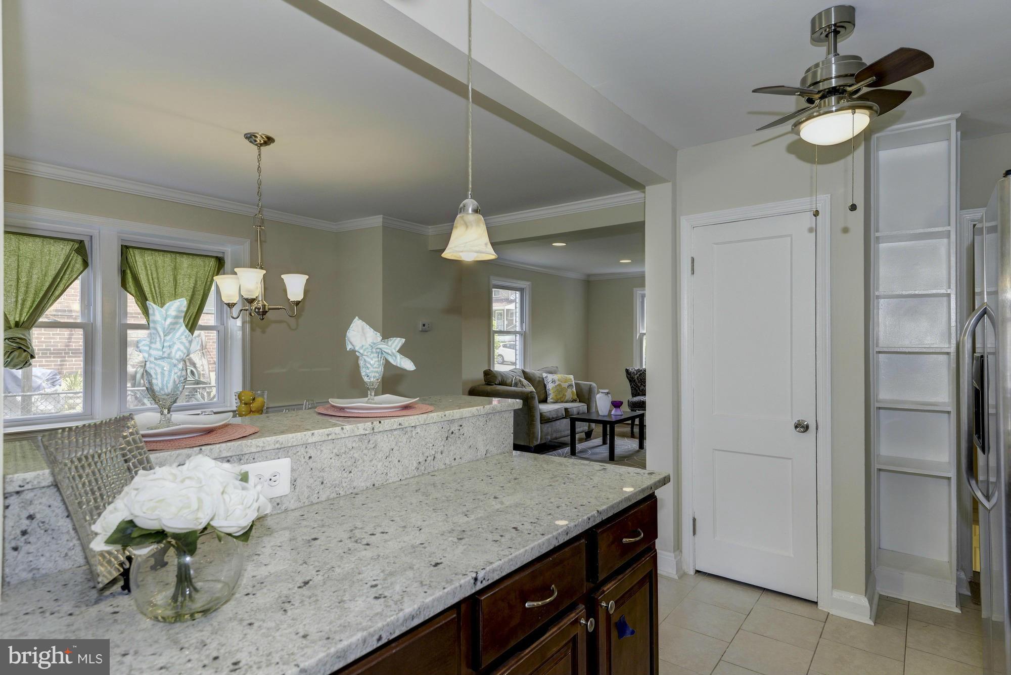 1901 Swansea Road Baltimore, MD 21239 - Photo 15 of 28 a bathroom with a granite countertop sink and a mirror